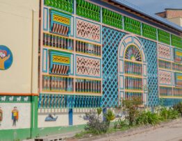 a colorful building with a mural on the side of it