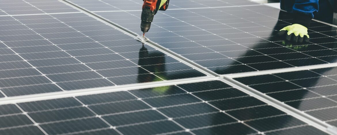 a person working on a solar panel