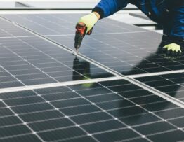 a person working on a solar panel